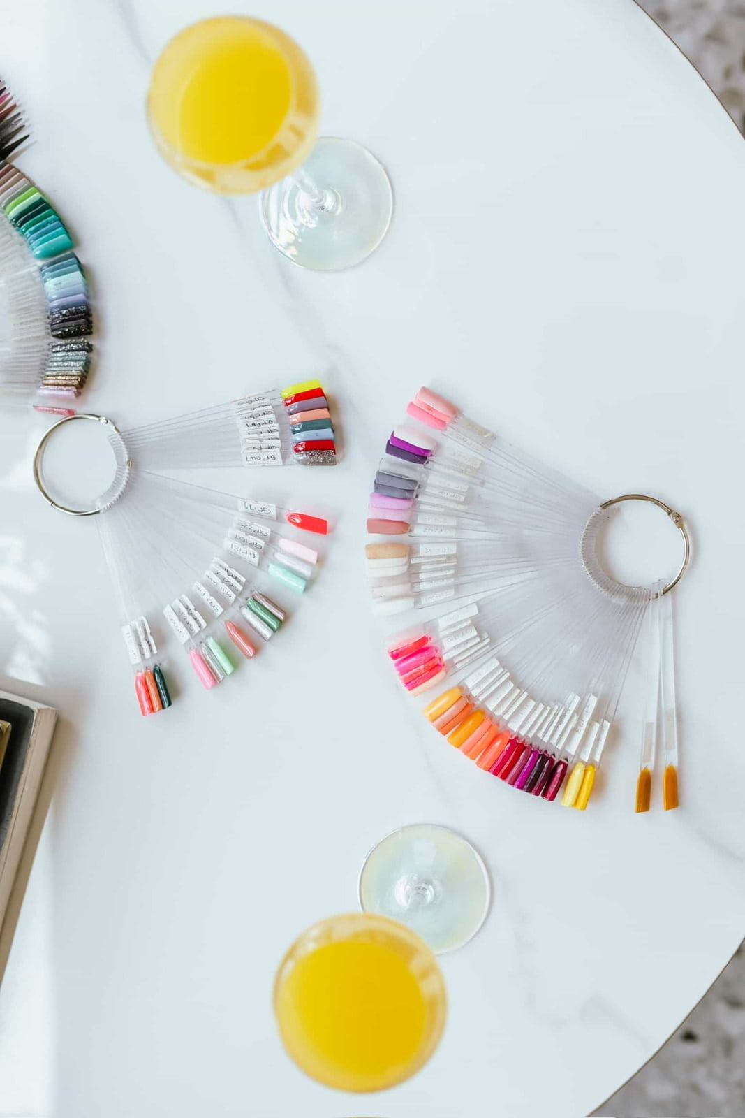 An image if mimosas next to nail extensions