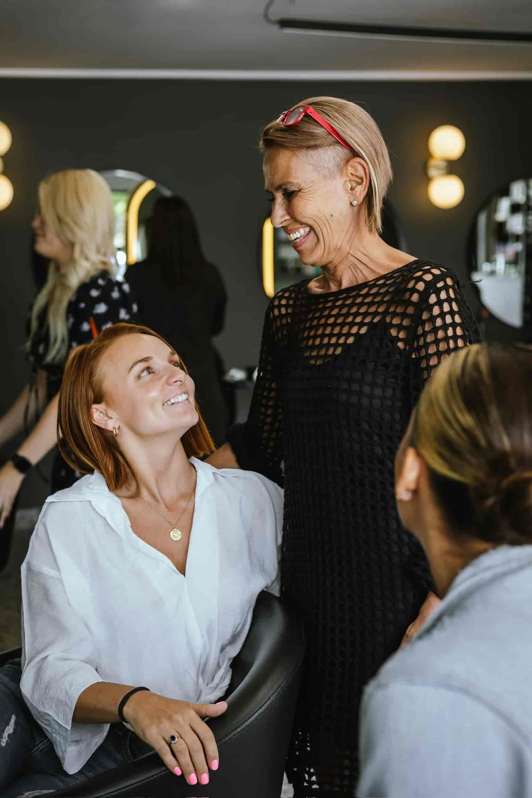 An image of Bonnie smiling and laughing with a customer