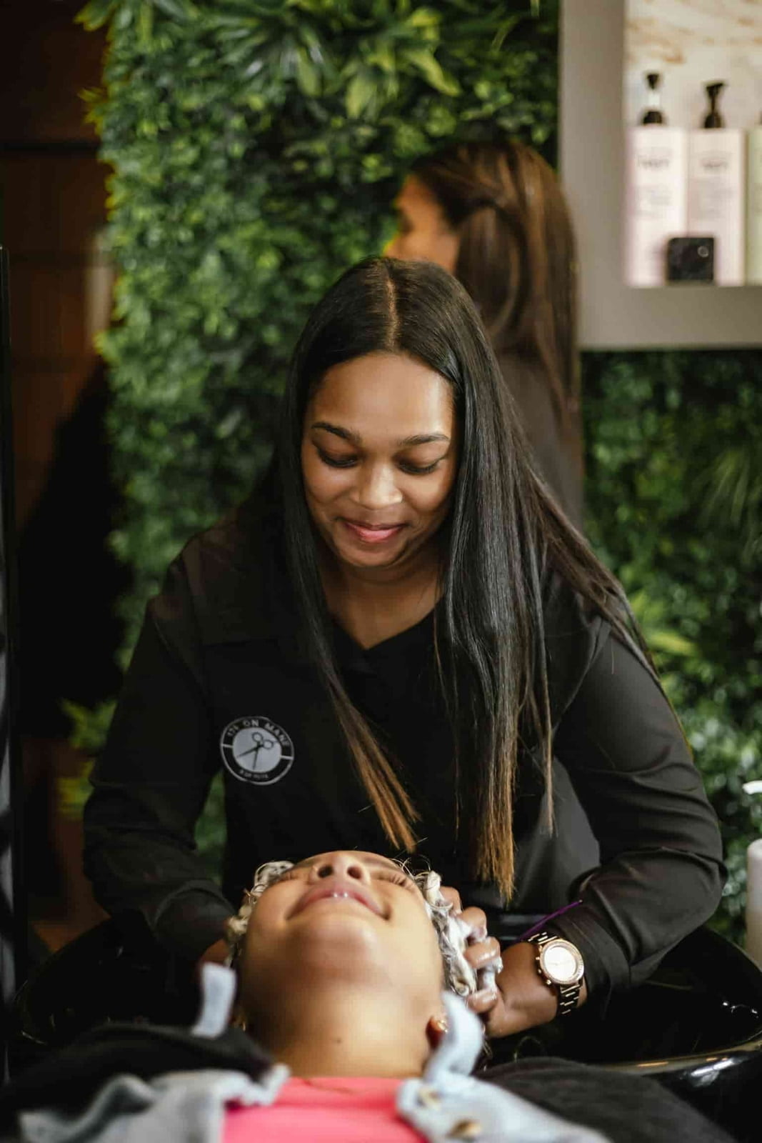 Shaundre washing hair at 178 On Mane Hair Salon